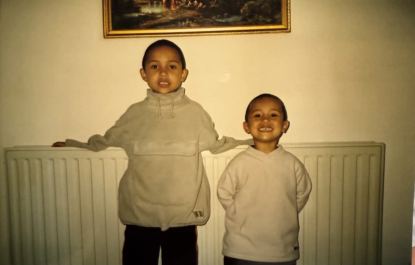 Ryan and Connor Hassan as young boys, at home